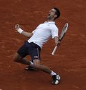 Novak Djokovic reacts as he defeats Jo-Wilfried Tsonga 