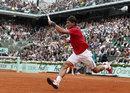 Rafael Nadal hits a running forehand