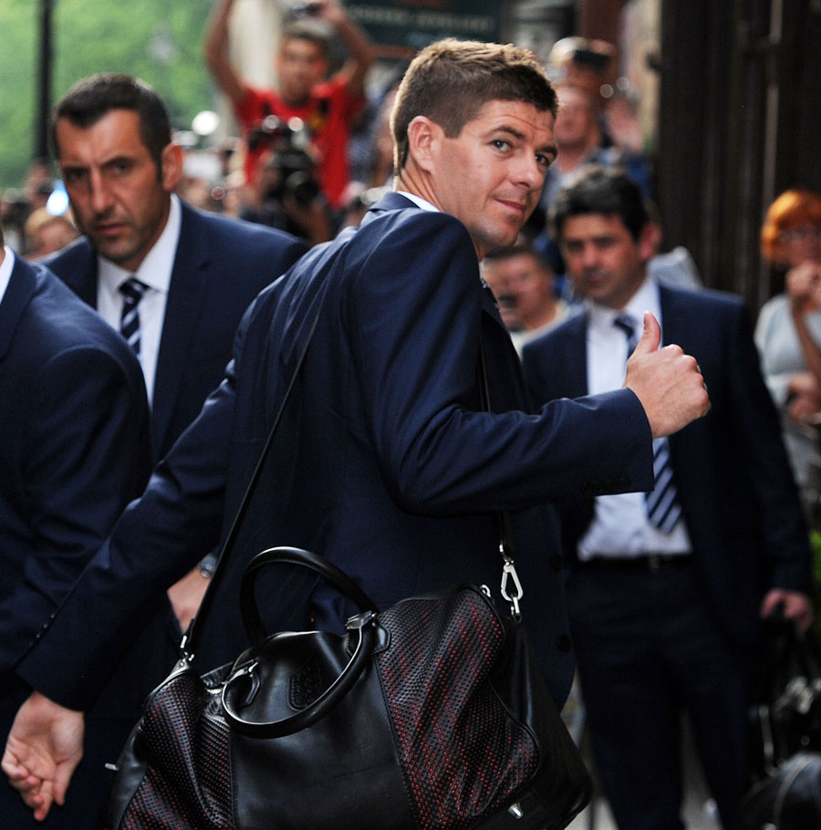Steven Gerrard makes his way inside the team hotel