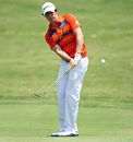 Rory McIlroy hits his third shot on the first hole
