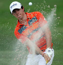 Rory McIlroy lobs the ball out of the bunker