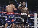 Timothy Bradley and Manny Pacquiao return their corners