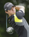 Rory McIlroy hits a drive at the sixth