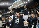 Willie Mitchell raises the Stanley Cup