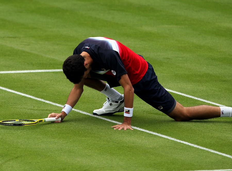 James Ward slips while in action against Kevin Anderson
