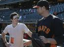 Rory McIlroy talks with San Francisco Giants pitcher Ryan Vogelsong