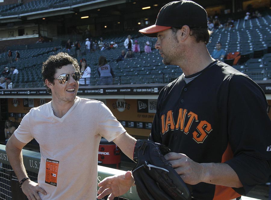 Rory McIlroy talks with San Francisco Giants pitcher Ryan Vogelsong