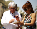 Bernie Ecclestone signs an autograph