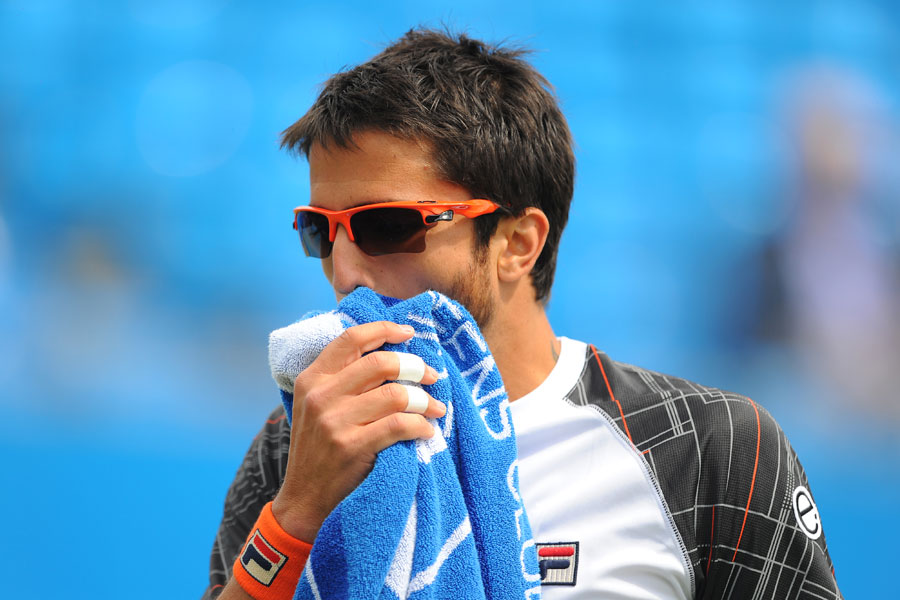 Janko Tipsarevic wipes his face with a towel