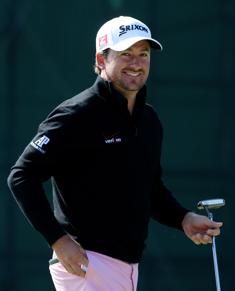 Graeme McDowell smiles after another completed hole