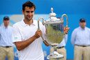 Marin Cilic shows off his new trophy