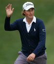 Webb Simpson waves to the fans