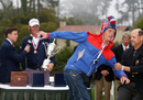 A fan is tackled by USGA executive director Mike Davis