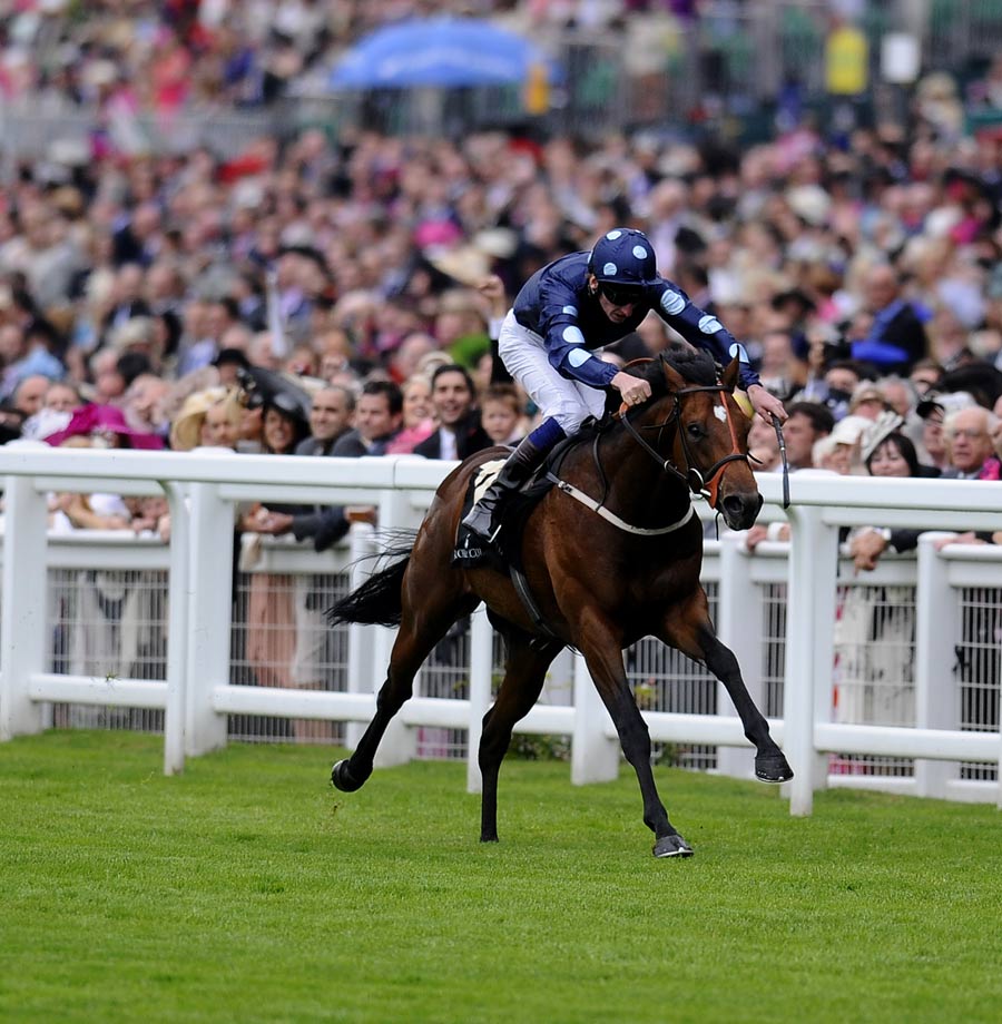 Adam Kirby leads Reckless Abandon to glory in the Norfolk Stakes