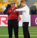 Steven Gerrard checks his watch alongside Roy Hodgson at the Olympic Stadium 