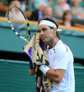 Rafael Nadal wipes his face