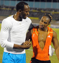 Yohan Blake is congratulated by Usain Bolt after winning the 100m final