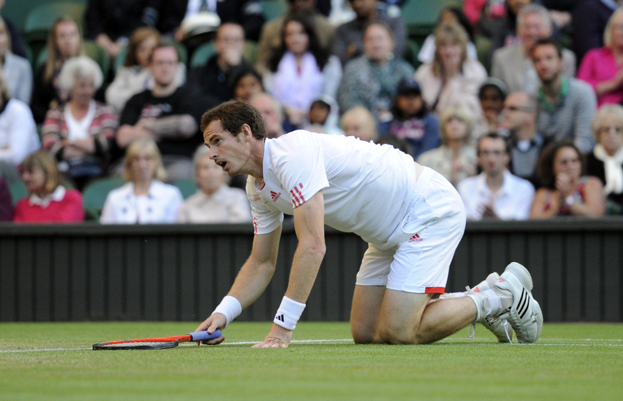 Andy Murray is left sprawled on the court