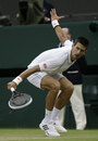 Novak Djokovic fashions a drop shot