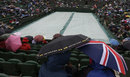 Spectators brave the rain
