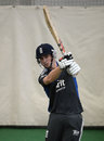 Chris Woakes cracks a ball during a net session