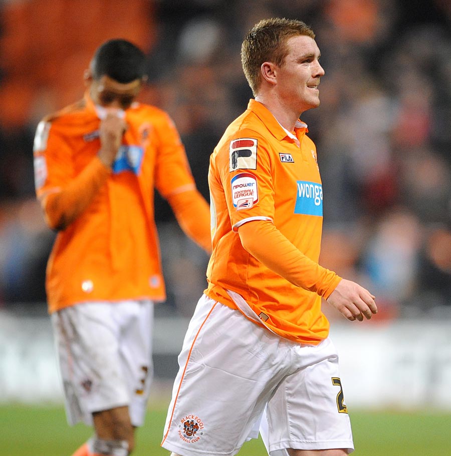 Thomas Ince and John Fleck leave the field dejected