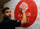 Louis Smith signs the TEAM GB autograph wall