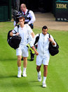 Andy Murray and Jo-Wilfried Tsonga make their way onto court