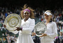 Agnieszka Radwanska and Serena Williams pose with their trophies
