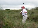 Donald Trump plays a round of golf after the opening of The Trump International Golf Links Course