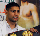 Amir Khan shows off his WBA title belt