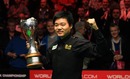 Ding Junhui celebrates after defeating John Higgins