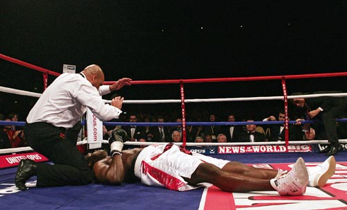 Audley Harrison is counted out after being knocked down by Michael Sprott