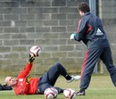 Jose Reina exercises with goalkeeping coach Xavi Valero