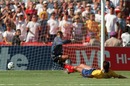 Andres Escobar lies on the ground after scoring an own goal