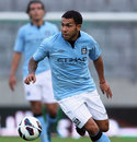 Carlos Tevez looks for a pass