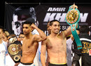 Amir Khan and Danny Garcia pose with their belts