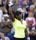 Serena Williams waves to the crowd after her win over Sorana Cirstea