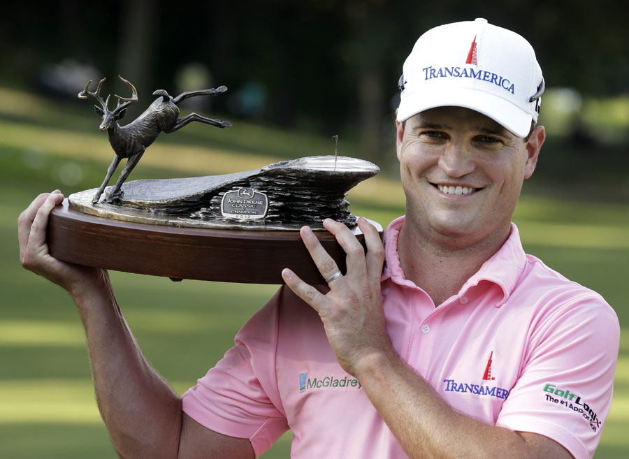 Zach Johnson poses with the winner's trophy