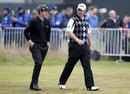Luke Donald walks up the fairway with Lee Westwood