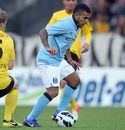 Carlos Tevez moves away with the ball
