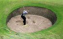 Ian Poulter plays out of a bunker