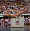Greg Louganis hits the end of the springboard
