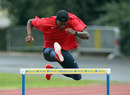Michael Tinsley takes a hurdle during a Team USA training session