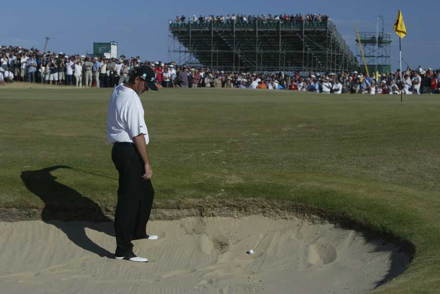 Thomas Bjorn shows his frustration as his ball sits in the bunker 