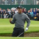 Tiger Woods roars after holing at 18