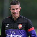 Robin van Persie cuts a relaxed figure at Arsenal training