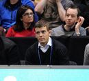 Jack Wilshere looks on as Jo-Wilfried Tsonga competes against Tomas Berdych