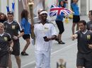 Phillips Idowu carries the Olympic Flame