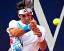 Thomaz Bellucci hits the ball against Janko Tipsarevic
